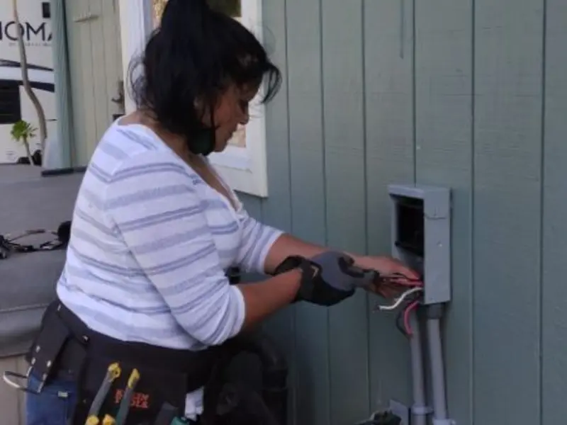 Licensed electrician wiring an exterior subpanel in Oronogo