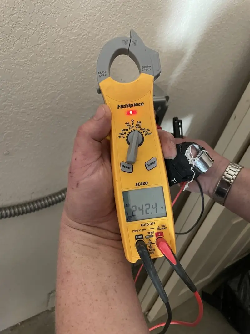 Voltage testing with clamp meter during Recessed Lighting Installation in Oronogo